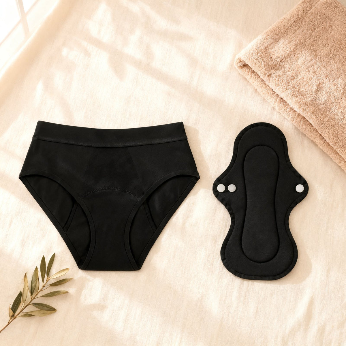 Dried Angels leak protection panty and reusable absorbent pad laid flat